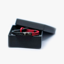 Pulsera Athletic Club roja y negra de cuero trenzado con nudo marinero en caja de producto oficial